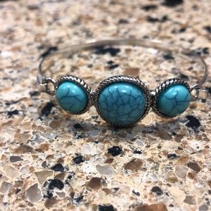 Silver bangle with turquoise like stones